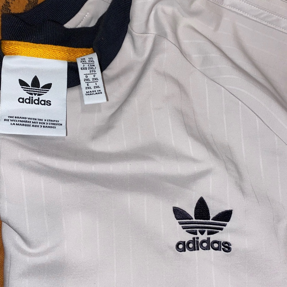 Adidas men’s tuck point pants with shirt.